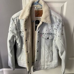 Levi’s denim jacket with plush lining and silver metal star decals